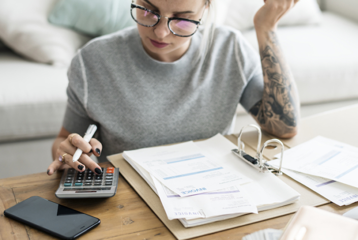 How To Improve Your Invoicing Process Woman working on invoicing process